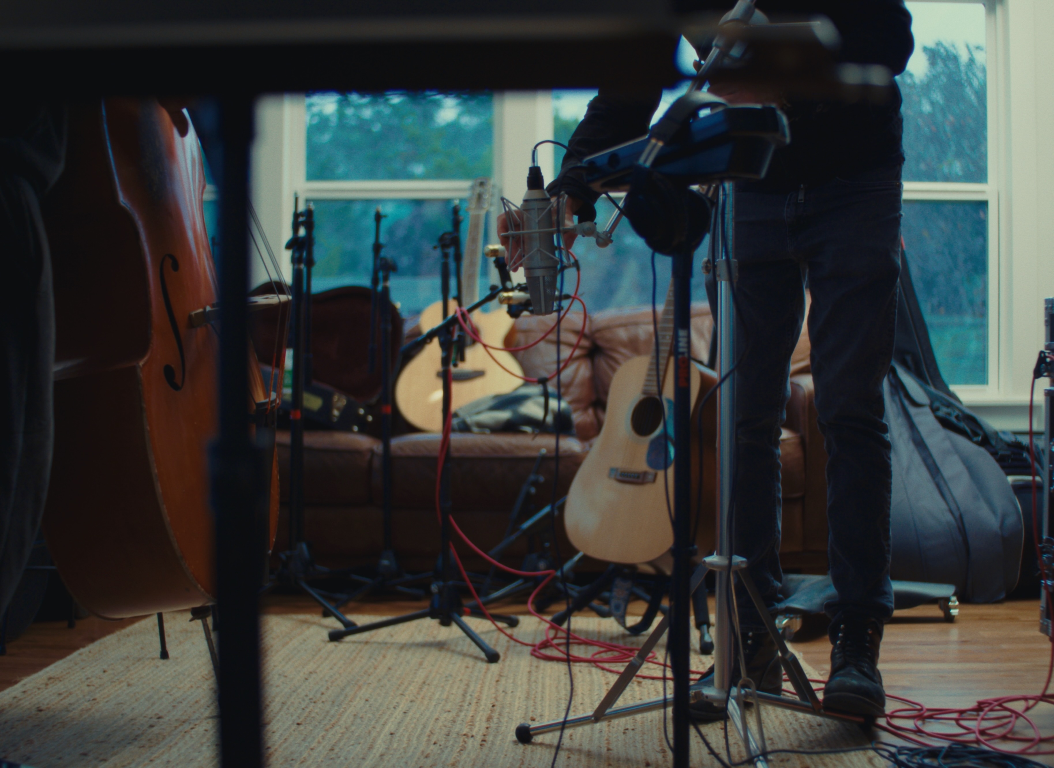 Microphones and instruments set up in living room