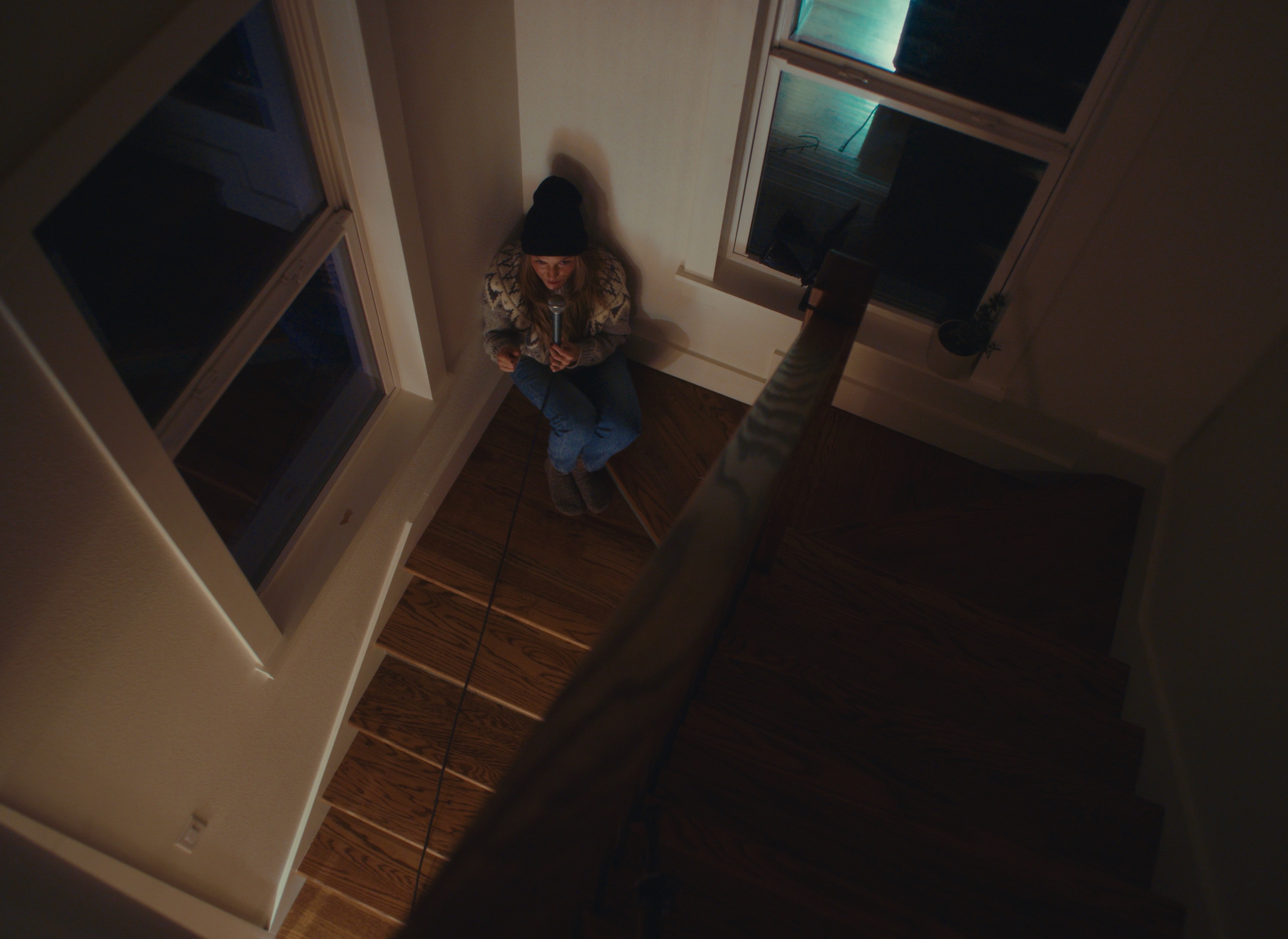 Katrina Cain recording vocals in stairwell