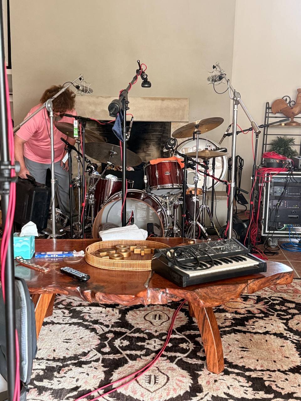 Drum kit set up in front of the fireplace